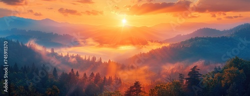 Wilderness Awakening: Warm Hues of Sunrise Over Rugged Peaks and Dense Mist-Covered Forest