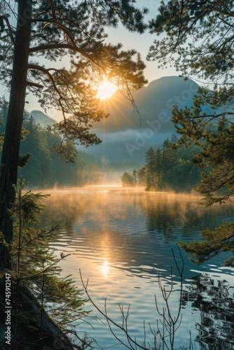 Panoramic Dawn in Wilderness: Calm Lake with Rising Mist, Surrounded by Pine Forest and Mountains, Bathed in the Warmth of Sunlight Through the Trees © Landscape Planet