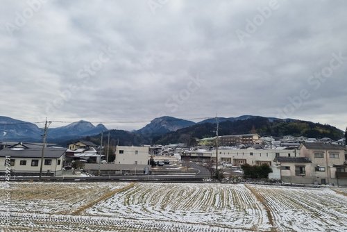View of landscape Yufuin village in the winter after snow fall © pumppump