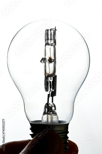 electric bulb with halogen filament on white background © BENEJAM