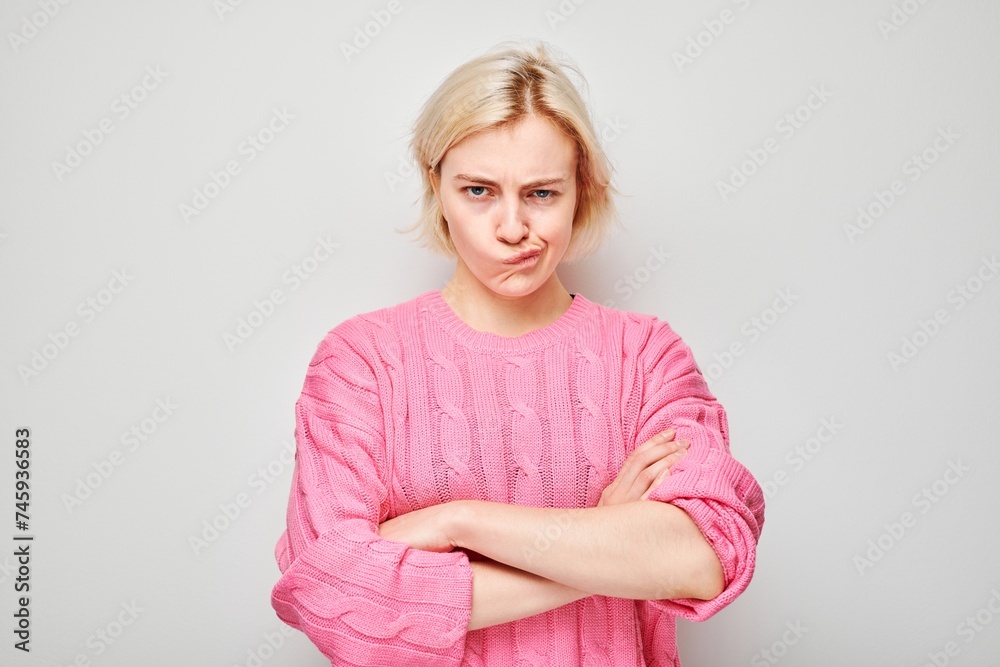 Portrait of girl with sad face offended and crying on white background. Nerves, stress, uncertainty concept. Portrait of girl with sad face offended and crying on white background. Nerves, stress, uncertainty concept.
