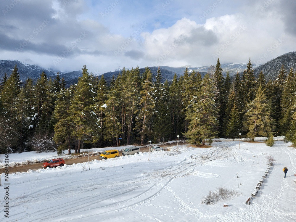 Fototapeta premium Beautiful snowy white mountains view in the famous Bansko ski resort in Bulgaria