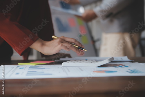 Close up of Business team analyzing income charts and graphs with modern laptop computer. Business analysis and strategy concept.