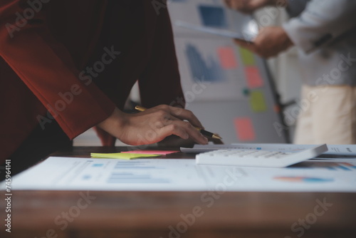 Close up of Business team analyzing income charts and graphs with modern laptop computer. Business analysis and strategy concept.