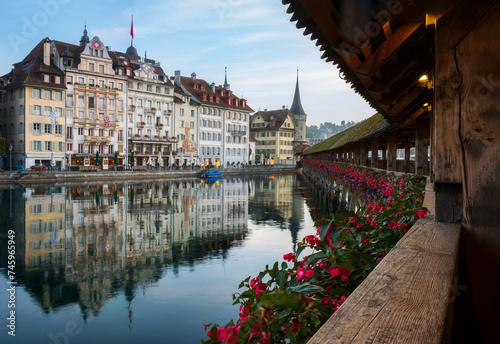 The Kapellbrücke (Chapel Bridge) on an early morning in the city of Lucerne, Switzerland. photo