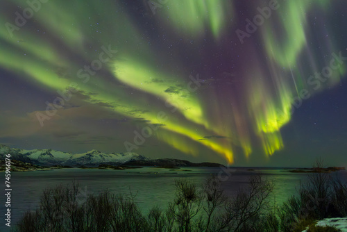 Aurora Borealis panorama during winter taken near Sommaroy, located near Tromso and Kavaloy, Norway