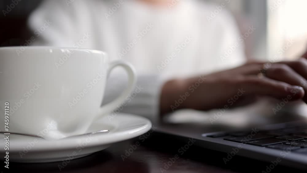 Close-up of hands of unrecognizable businesswoman typing on laptop keyboard while working online. The concept of remote work online, freelancing and successful business. Close-up of hands of unrecognizable businesswoman typing on laptop keyboard while working online. The concept of remote work online, freelancing and successful business.