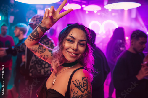 Girl dancing in a nightclub having fun and posing