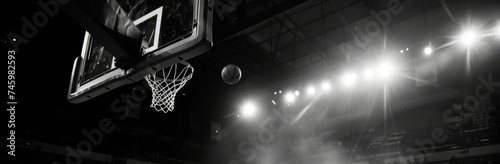 On the basketball court the ball flies towards the hoop..