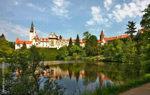 Castle park in Průhonice in the Czech Republic, view across the lake to the castle
