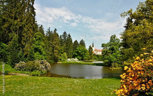 Castle park with lake and forest, castle in the background. Czech Republic, Průhonice
