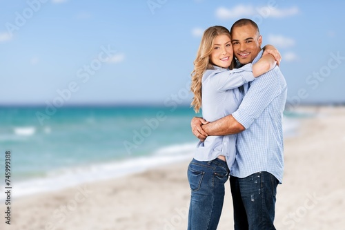 Portrait of beautiful happy couple together on the beach.