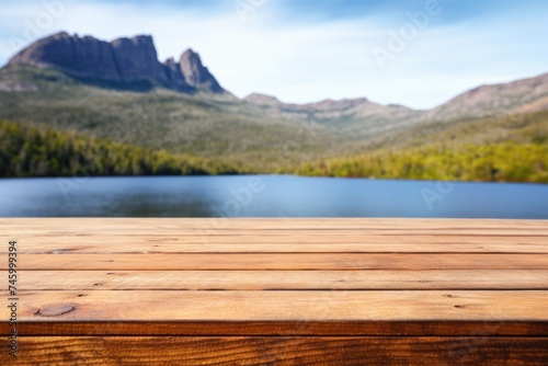 The empty wooden brown table top with blur background of Cradle mountain in Tasmania. Exuberant image. generative AI