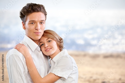 Portrait of beautiful happy couple together on the beach.