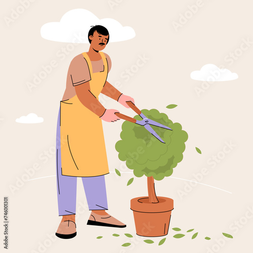 Gardener working in garden.