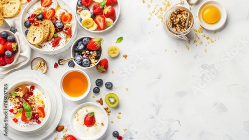Healthy Breakfast Assortment Top View - Top view of a fresh and healthy breakfast spread with various fruits and cereals on a white background