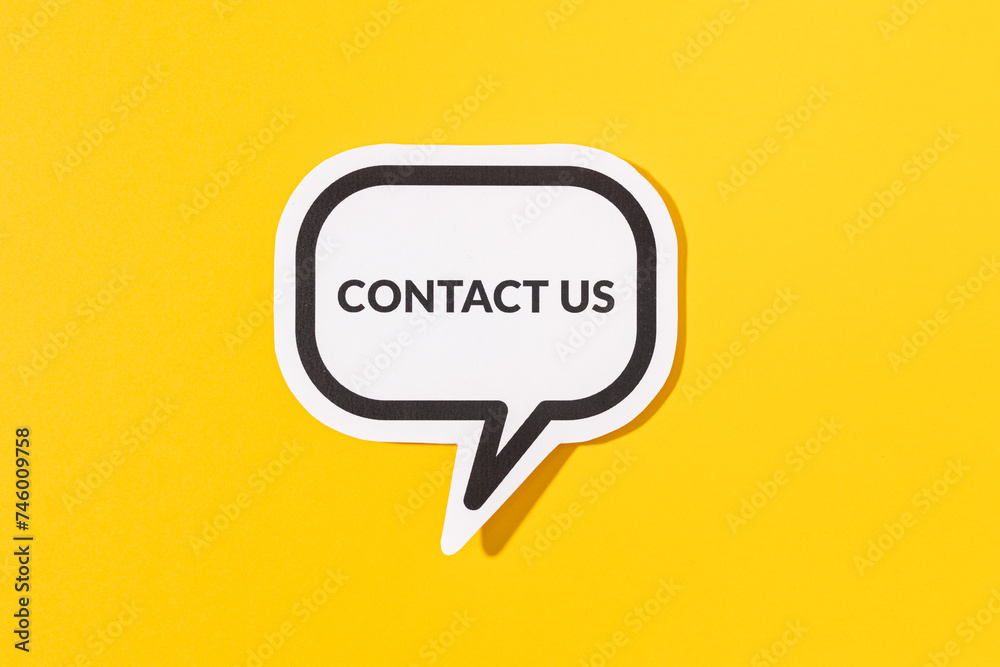 Contact Us text on speech bubble isolated on yellow background Contact Us text on speech bubble isolated on yellow background