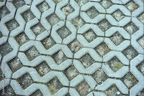 Concrete openwork plates used as garden road and parking lot for cars photo