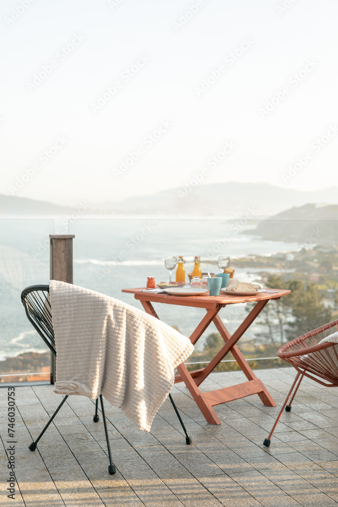 Seaside Terrace Breakfast Setup with Ocean View
