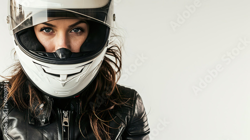 Female motorcycle rider posing with a white helmet