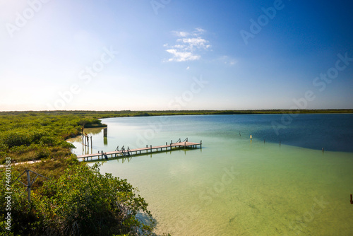 Muelle. Beautiful blue hole Kaan Luum lagoon in Tulum, Quintana Roo in Mexico. photo