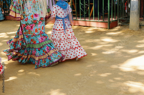 woman and daughter wearing flamenco dress, Seville, Spain