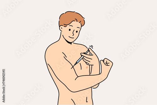 Man bodybuilder uses doping to quickly achieve results in sports, gives injection in biceps. Dishonest athlete takes banned doping to defeat opponents in international competitions