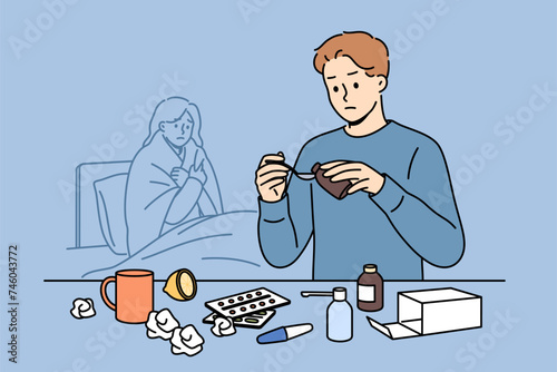 Man helps woman recover by pouring medicinal syrup and preparing flu pills, standing near bed with sick wife. Guy caregiver takes care of sick sister suffering from infection or virus.