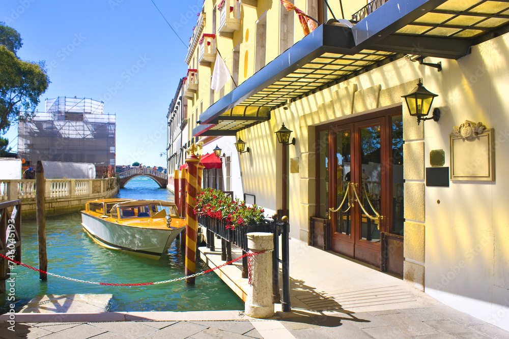  Beautiful romantic Venetian cityscape with motor boat, Italy