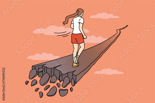 Woman runs along crumbling path, for concept of overcoming problems and escaping from crisis. Last chance to save yourself for girl who needs help getting out of personal or career crisis