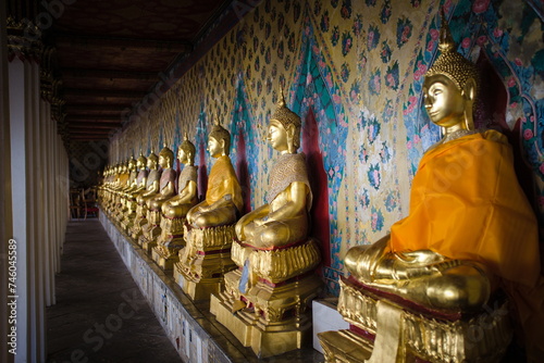 Golden Buddhas in a temple in Thailand