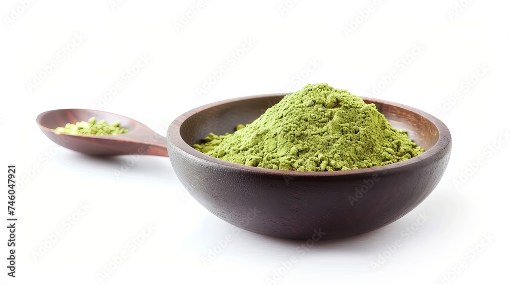 Matcha green tea powder on a wooden spoon in a bowl, isolated on white Matcha green tea powder on a wooden spoon in a bowl, isolated on white