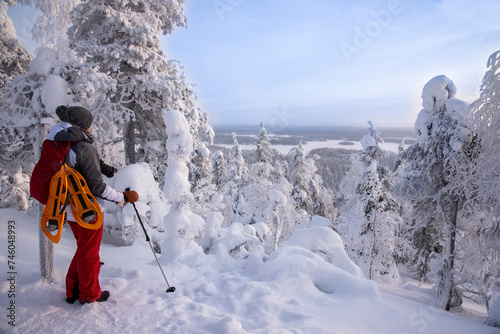 Woman showshoeing on snowy mountain