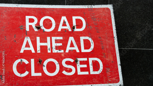 Closeup of a Road Ahead Closed sign 