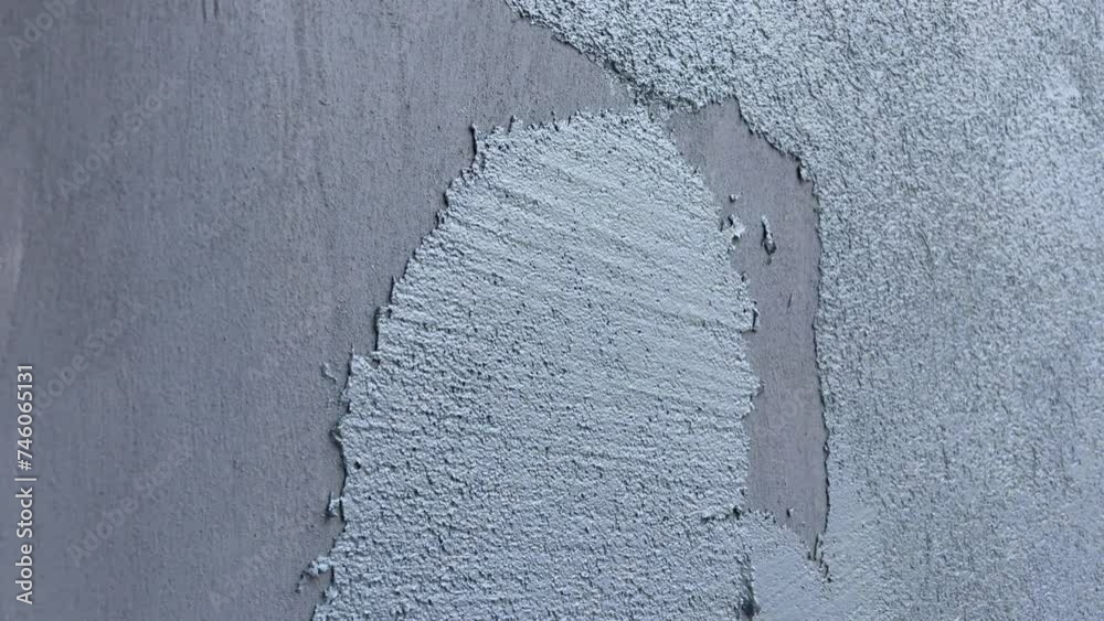 Repair of a private house, modern decorative plaster. Horizontal video of applying plaster to a wall.