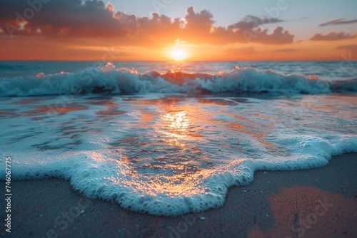 A serene ocean scene as the sun sets creating a vibrant sky and gentle foamy waves, conveying peace and natural beauty