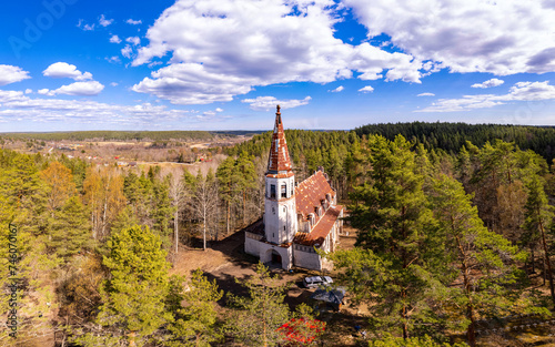 Aerial top view to Finnish Lutheran Church in Lumivaara village. Building in Neo-Gothic style in summer sunny day. Attractions of Lahdenpokh district. Designed architect Adolf Ilmari. Karelia Russia photo