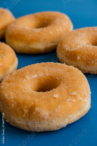 doughnuts on blue background © Tolo