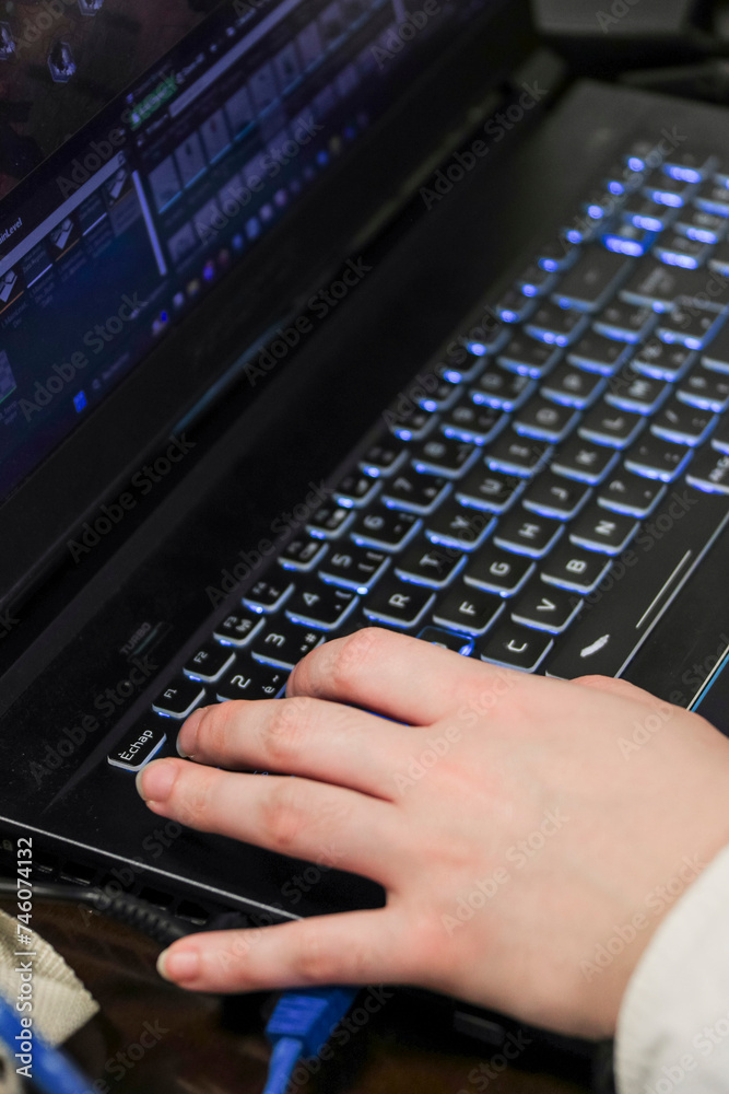 Close-up of hand on computer at meeting room.