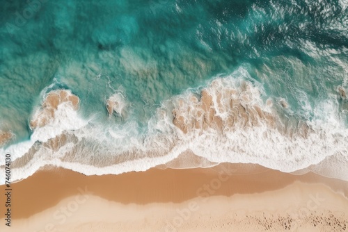Aerial View of Turquoise Waves Crashing on a Golden Beach