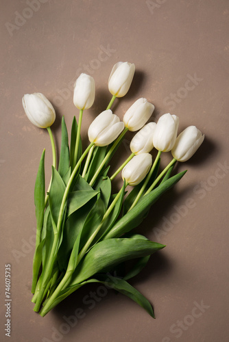 A bouquet of tulips on a beige background
