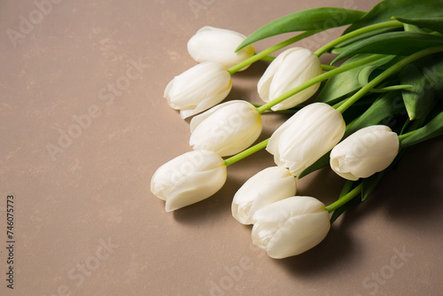 A bouquet of tulips on a beige background