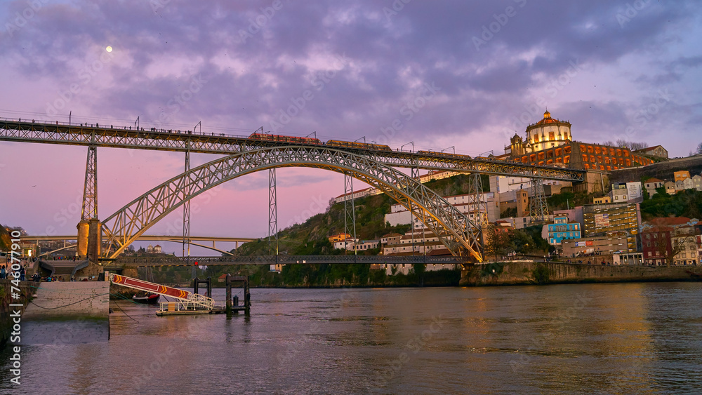 Picturesque view of old town Porto, Portugal with bridge Ponte Dom Luis over Douro river.