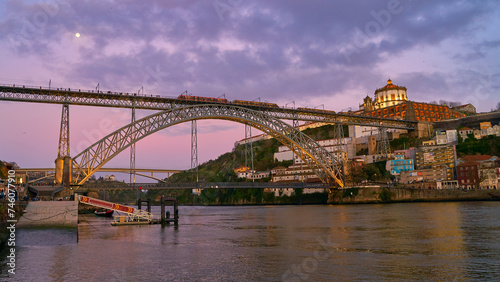 Picturesque view of old town Porto, Portugal with bridge Ponte Dom Luis over Douro river.