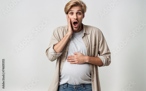 Image of a surprised pregnant man, an art project that plays with gender stereotypes and identity