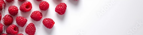 raspberries on a white background with space for text.
