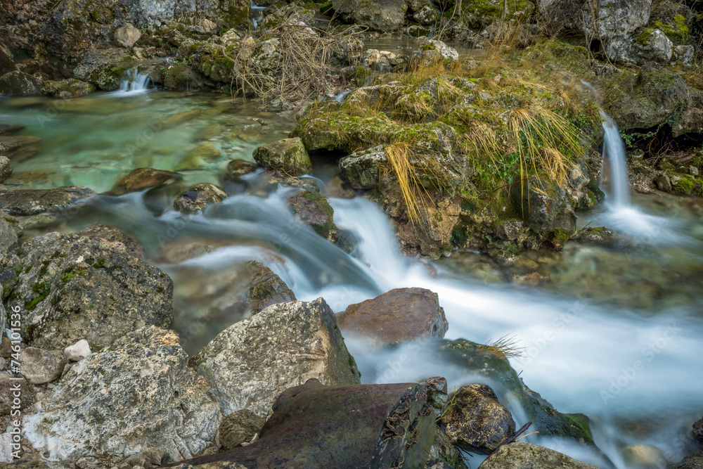 Detail of small waterfalls at the source of the Mundo River in Riopar, Albacete, Castilla la Mancha, Spain with soft light Detail of small waterfalls at the source of the Mundo River in Riopar, Albacete, Castilla la Mancha, Spain with soft light