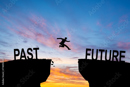 Silhouette of business man jump between past and future text. keep go on to success concept at 2024 over a beautiful sunset or sunrise at the sea background. success in 2024 years.