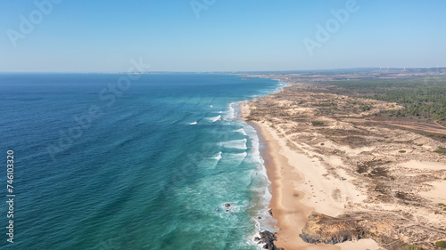 An aerial view of Malhao beach popular for surfing and vacationing tourists. Bird's eye view.