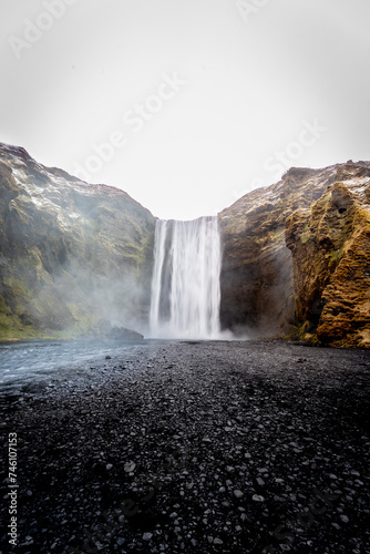 Vertical photo of Skogafoss with empty space black and white